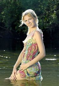 Babes: young blonde girl in a small river