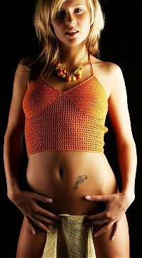 Babes: young blonde girl wearing orange knit shirt