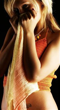 Babes: young blonde girl wearing orange knit shirt