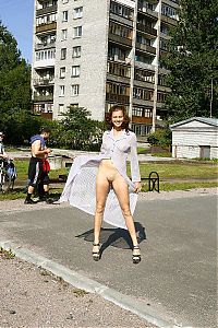 Nake.Me search results: young curly brunette girl poses outside on the street