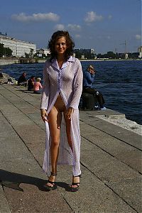 Nake.Me search results: young curly brunette girl poses outside on the street