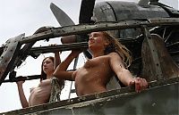 Babes: two young girls posing with the old airplane