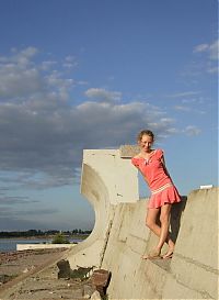 Nake.Me search results: young curly blonde girl in pink dress near concrete walls