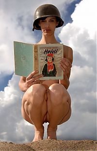 Babes: girl with a helmet reading the book about heidi
