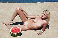 Nake.Me search results: young blonde girl on the beach eating a watermelon