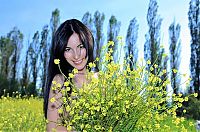 Babes: black haired girl on the field with yellow flowers