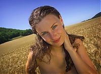 Nake.Me search results: young brunette girl with blue eyes reveals on a wheat field