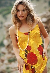 Babes: young blonde girl undresses a yellow dress in the ruins of ancient castle