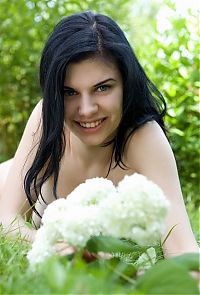 Babes: black haired girl with blue eyes taking photos in the nature