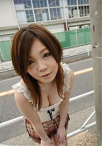 Babes: young asian girl taking photos at home