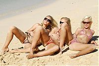 Nake.Me search results: three young blonde girls wearing extreme bikini on the beach