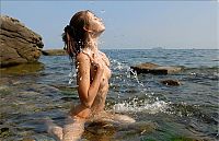 Babes: young skinny brunette girl posing on the rocky coast