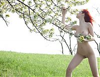 Nake.Me search results: young red haired girl on the glade area with a spring tree