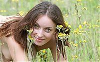 Babes: brunette girl on the field of wild flowers