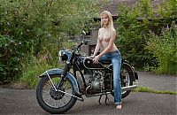 Babes: young blonde girl strips her jeans on the bike
