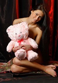 Babes: young black haired girl with a teddy bear