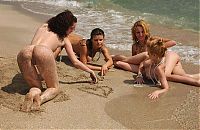 Babes: four young girls relaxing on the beach