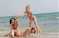 Babes: four young girls relaxing on the beach