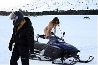 Babes: young brunette girl loves the winter and snowmobiles