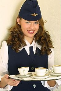 Nake.Me search results: curly brunette girl strips from the stewardess uniform