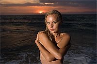 Babes: young blonde girl in the sea at sunset