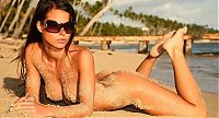 Babes: young brunette girl wearing sunglasses on the beach