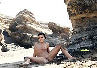 Babes: young black haired girl in the sand