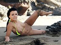 Babes: young black haired girl in the sand