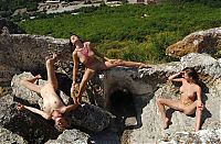 Babes: three cute young girls shows off on the hill on rocks