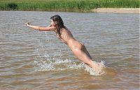 Babes: cute young brunette girl wet in the river