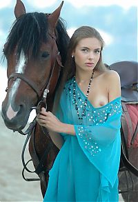Babes: cute young blonde girl posing with a horse