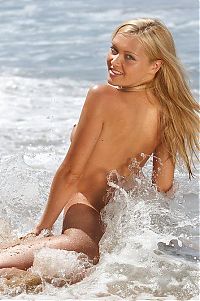 Babes: young blonde girl shows off at the sea