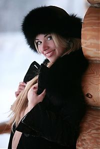 Babes: blonde girl wearing black coat in the winter
