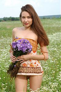 Babes: young brunette girl on the field of wild flowers