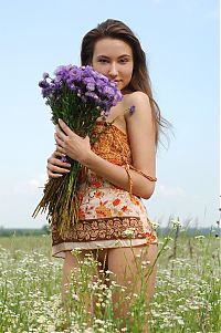 Babes: young brunette girl on the field of wild flowers