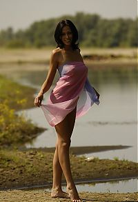 Babes: young brunette girl shows off with a pretty scarf at the river