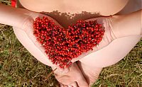 Nake.Me search results: young brunette girl strips her dress near mountain-ash shrubs with red berries