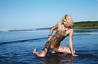 Babes: young curly blonde girl on the beach dirty from sand