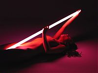 Nake.Me search results: cute young brunette girl posing with a neon tube lamp