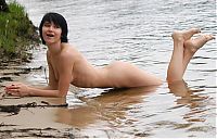 Babes: young black haired girl on the bank of the river