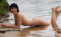 Babes: young black haired girl on the bank of the river