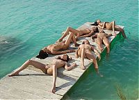Babes: six lesbian girls shows off on the pier at the sea