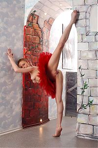 Babes: young red haired girl like a prima ballerina assoluta with a red ballet tutu skirt