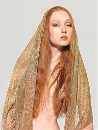 Babes: young red haired girl shows off with a golden scarf in the studio