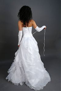 Babes: curly black haired girl strips her wedding dress in the studio