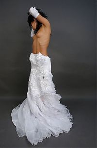 Babes: curly black haired girl strips her wedding dress in the studio