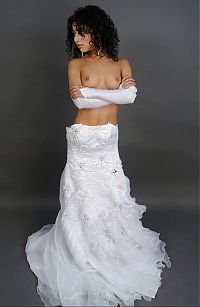 Babes: curly black haired girl strips her wedding dress in the studio