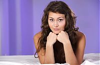 Nake.Me search results: young curly brunette girl shows off on the bed