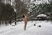 Babes: young black haired girl with a headband and boots outside in the amphitheatre in the winter