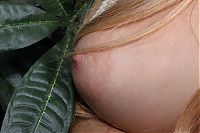 Nake.Me search results: young blonde girl undresses her white top and panties on the chair in the public bath area